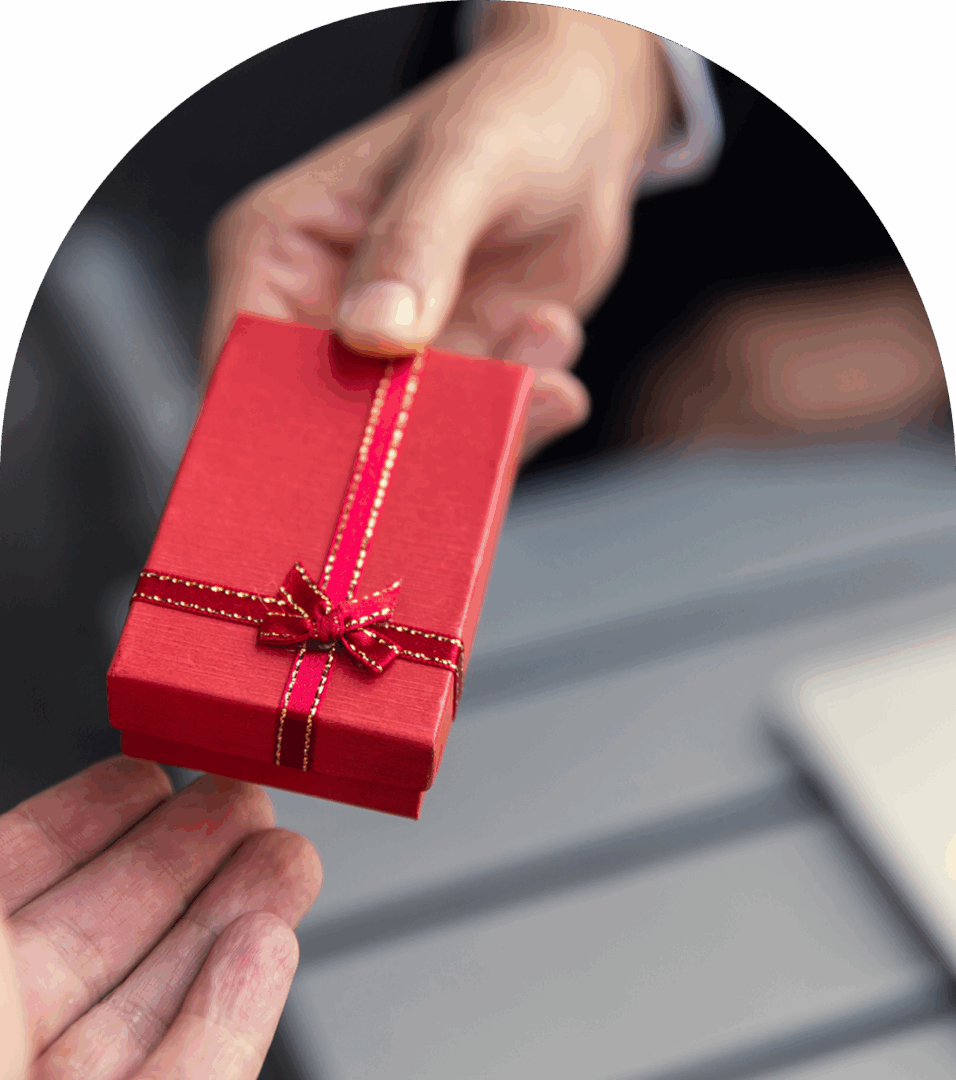 Small wrapped gift being handed over