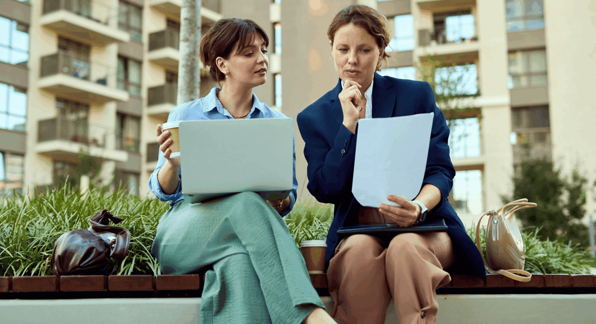 Colleagues reviewing documents outside