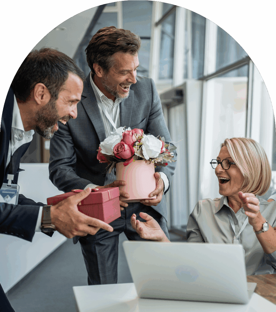 Office celebration with flowers and gifts