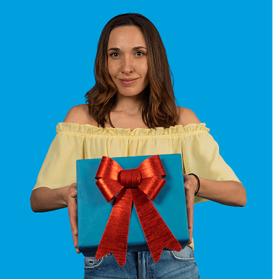 Woman holding a gift with red bow.