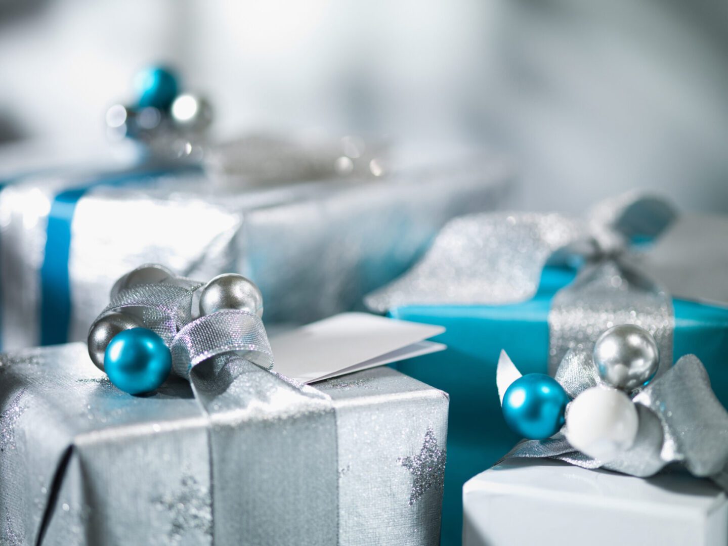 Silver and blue wrapped gift boxes.