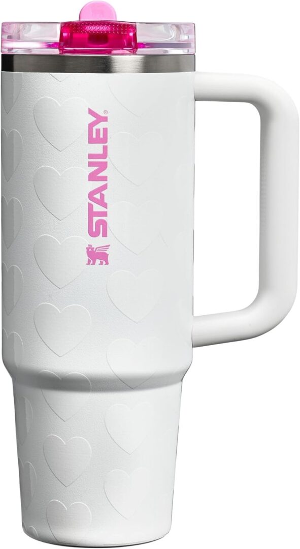 White travel mug with pink lid.