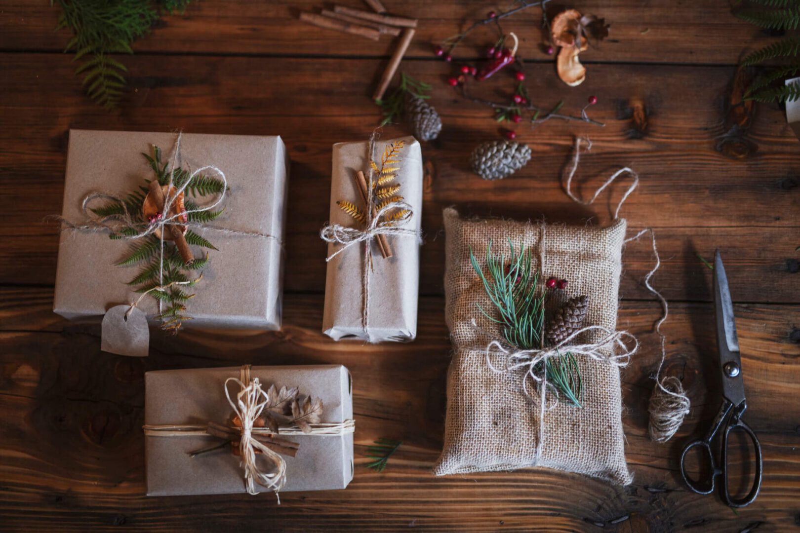 Rustic wrapped gifts with natural decorations.