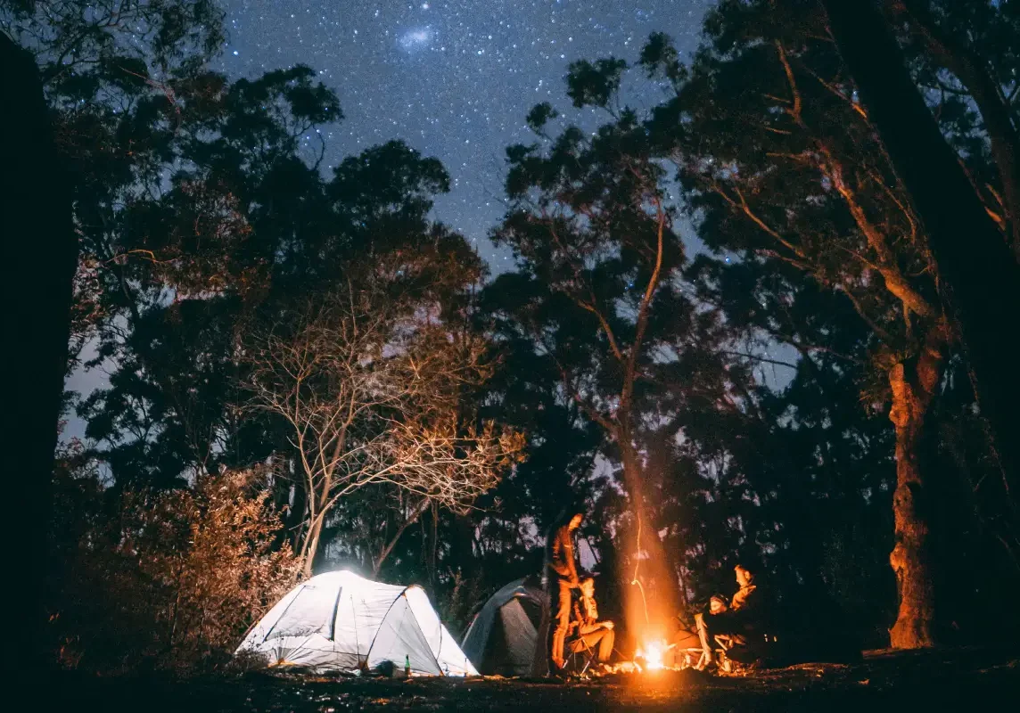 Camping under a starry night sky.