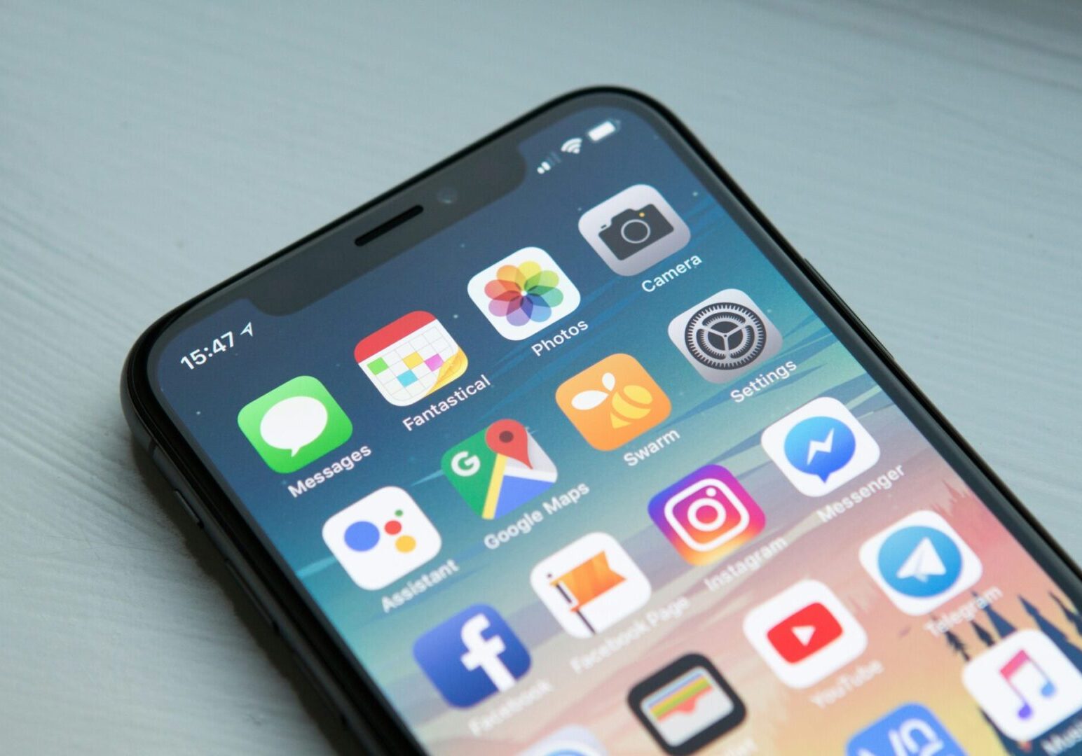 Smartphone displaying various app icons.